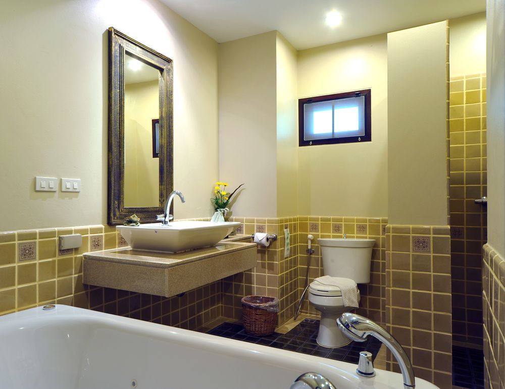 A Bathroom With A Sink, Toilet, And Bathtub — Damn Fine Constructions In Toormina, NSW