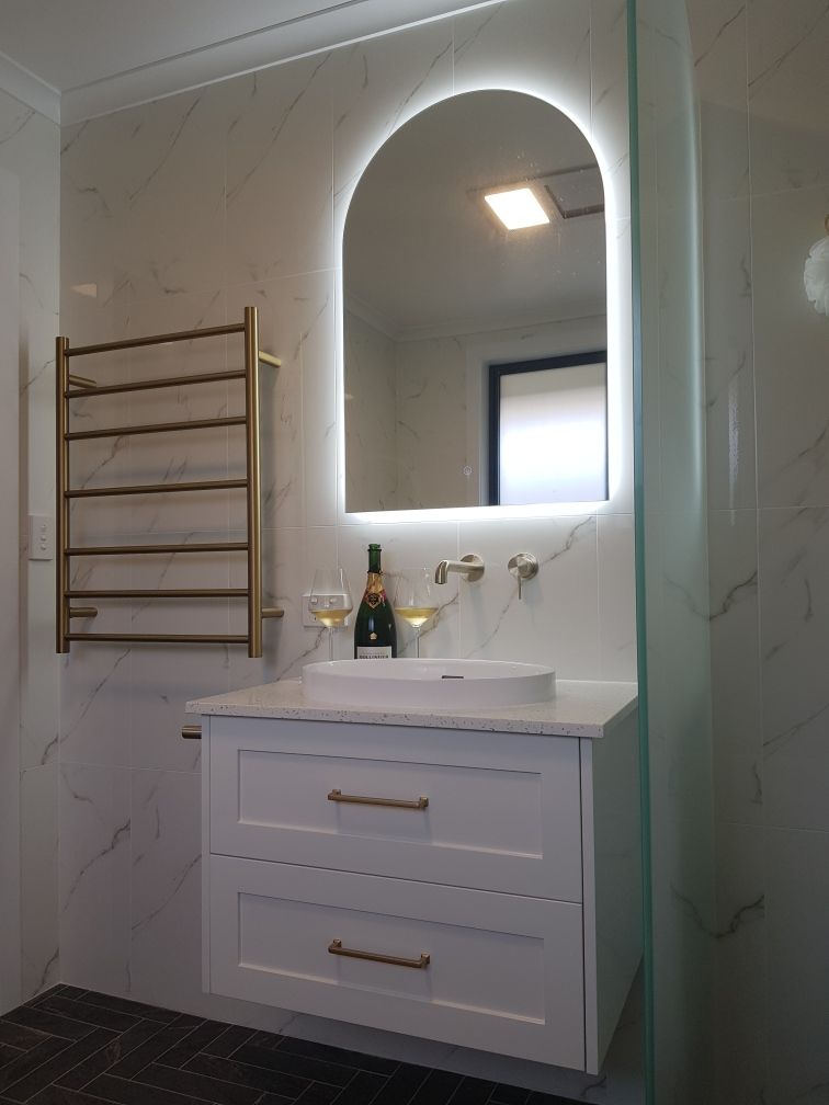 A Bathroom With A Sink, Mirror And Towel Rack — Damn Fine Constructions In Coffs Harbour, NSW