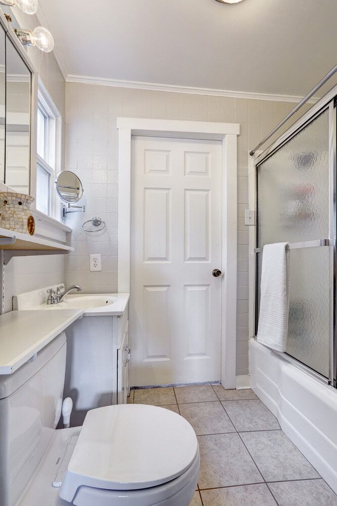 A Bathroom With A Toilet, Sink, and Shower — Damn Fine Constructions In Bonville, NSW