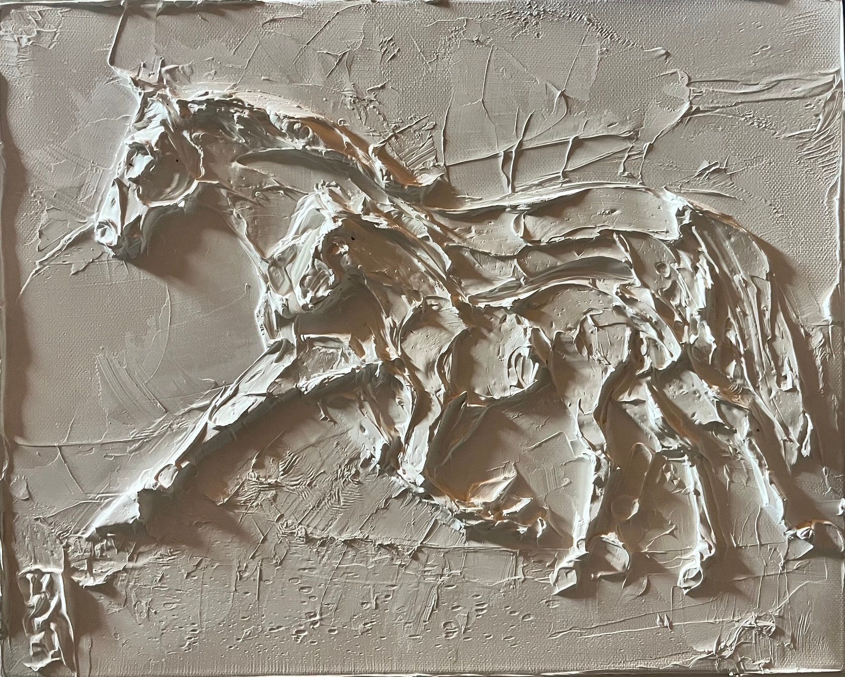 Abstract relief of a horse in beige tones, sculpted with rough, textured strokes