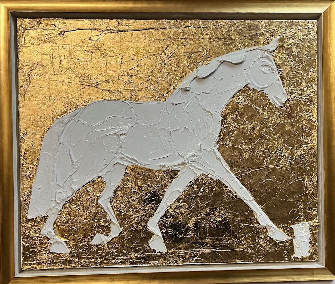 White textured horse silhouette on a gold textured background, in a gold frame.