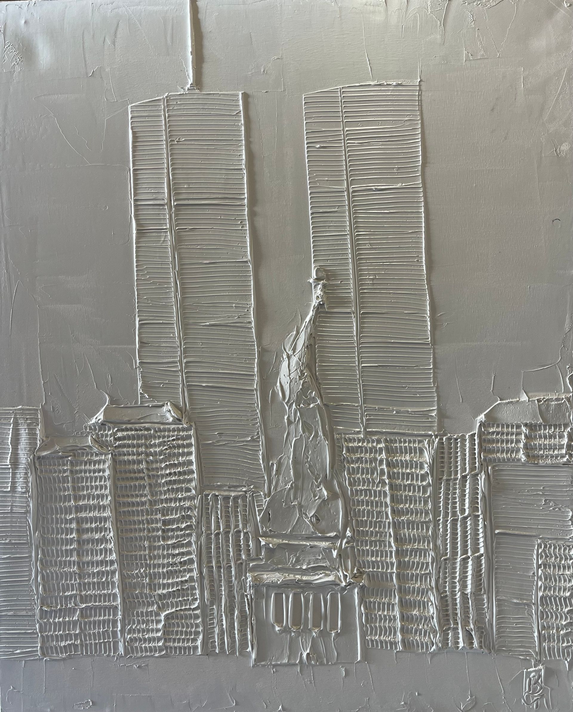 Silver relief of the Twin Towers and New York City skyline.