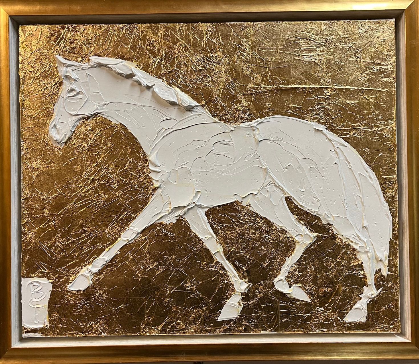 White textured horse on a gold textured background, framed.