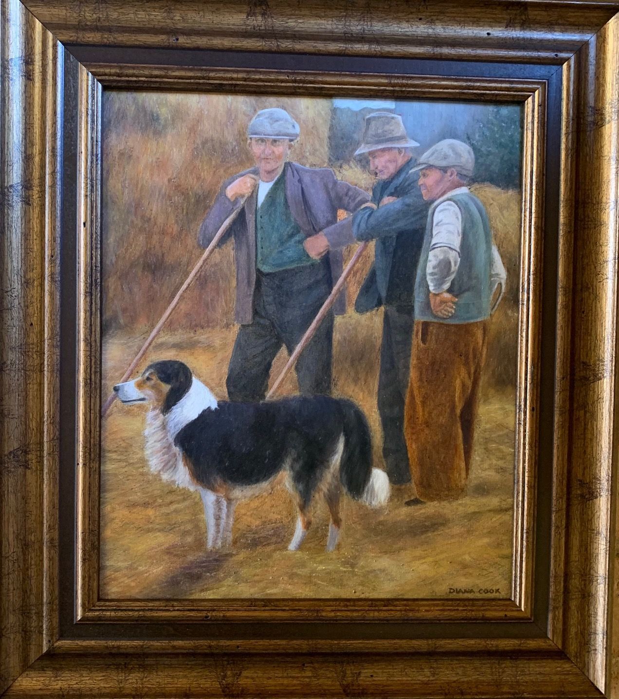 a framed painting of three men and a sheep dog