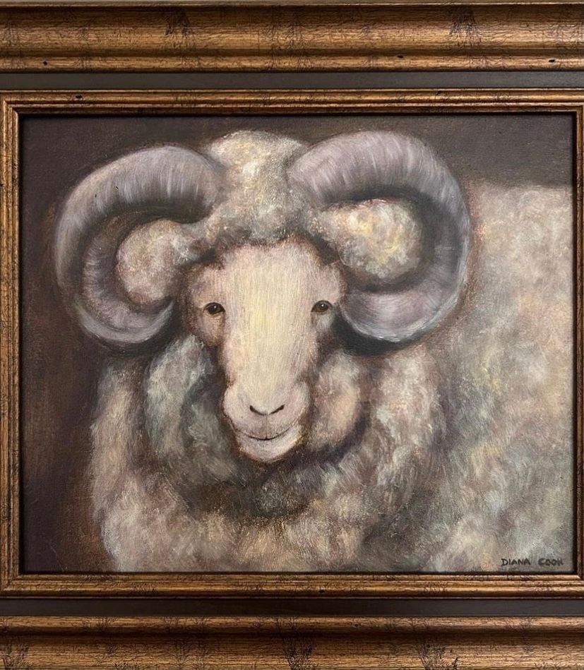 a framed painting of a ram by diana cook