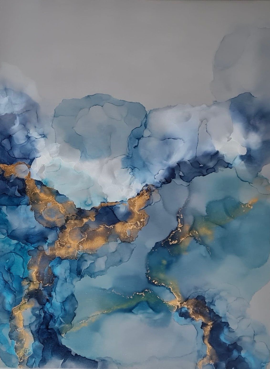 Abstract painting of blues and gold hues, resembling clouds or a landscape.
