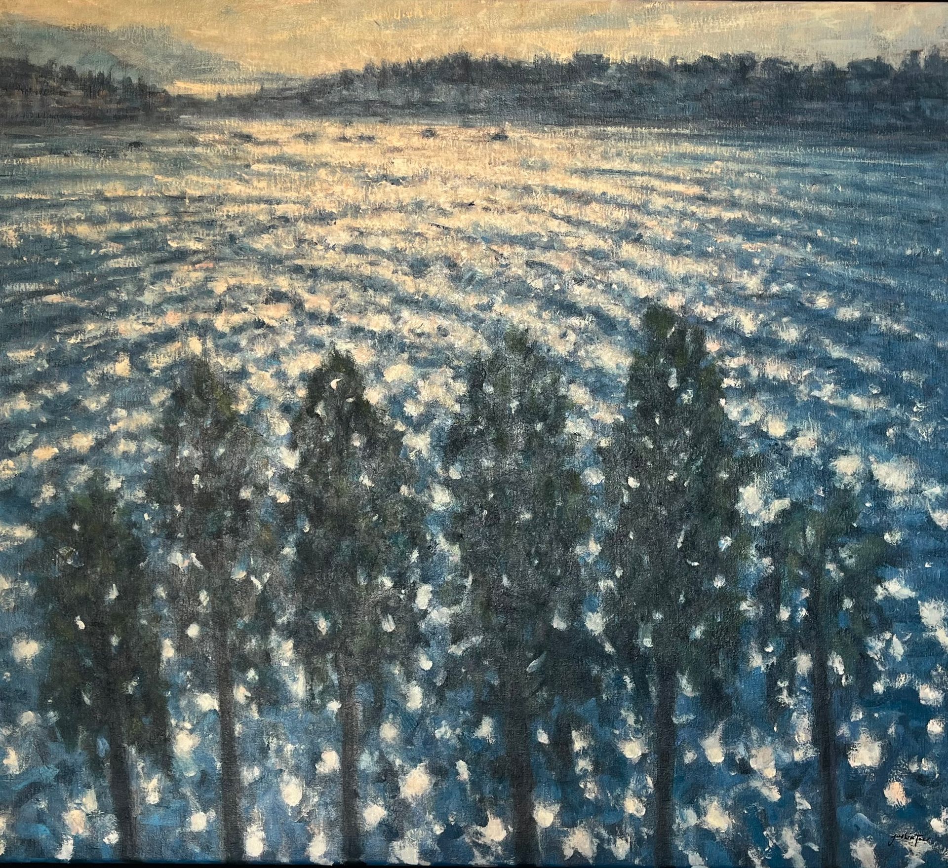 glistening water with dark trees under a pale sunrise sky.