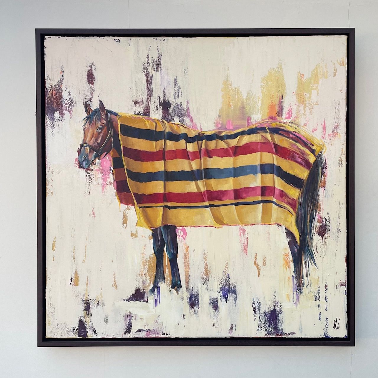 Horse covered in striped blanket; warm tones on a white background.
