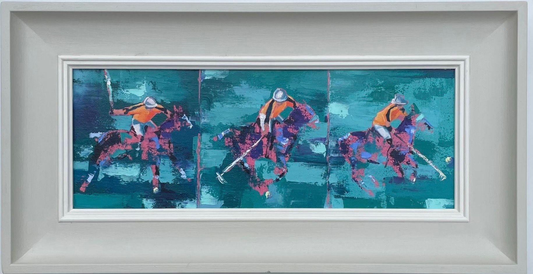 A painting of three people riding horses in a frame.