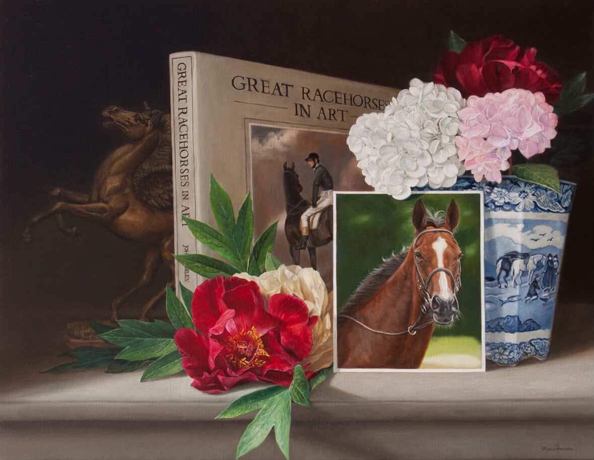 Floral arrangement with horse photo, book, and blue vase on a shelf