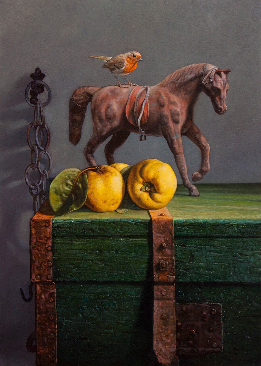 A painting of a horse and apples on a green box.