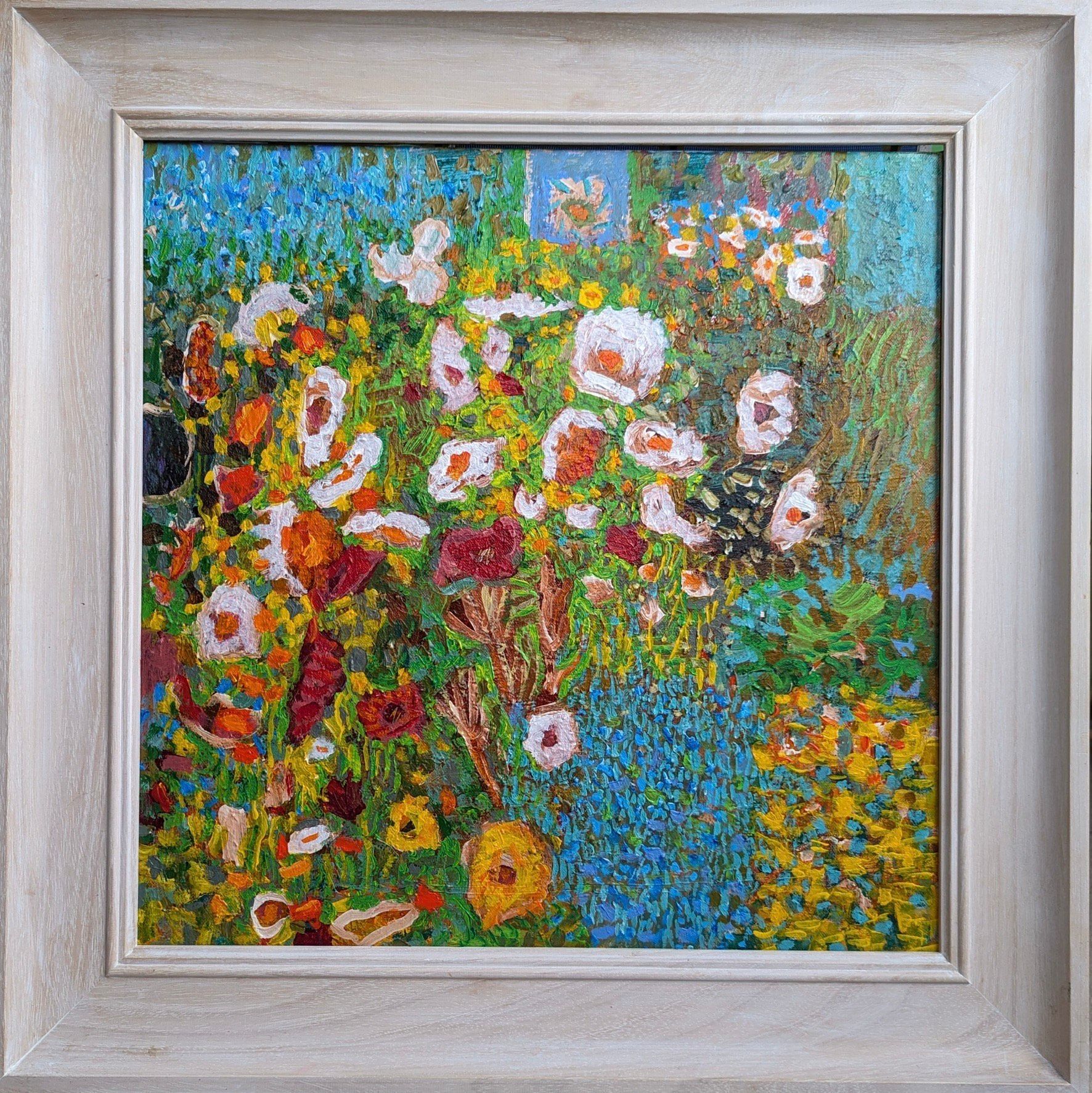 A painting of flowers in a white frame