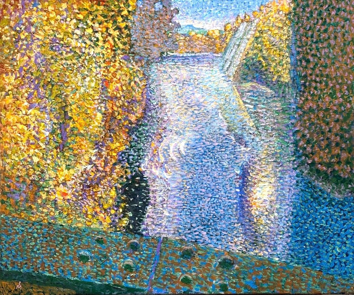 A Pointillist painting depicts a blue river flowing between dense trees with golden-yellow leaves, seen from a bridge.