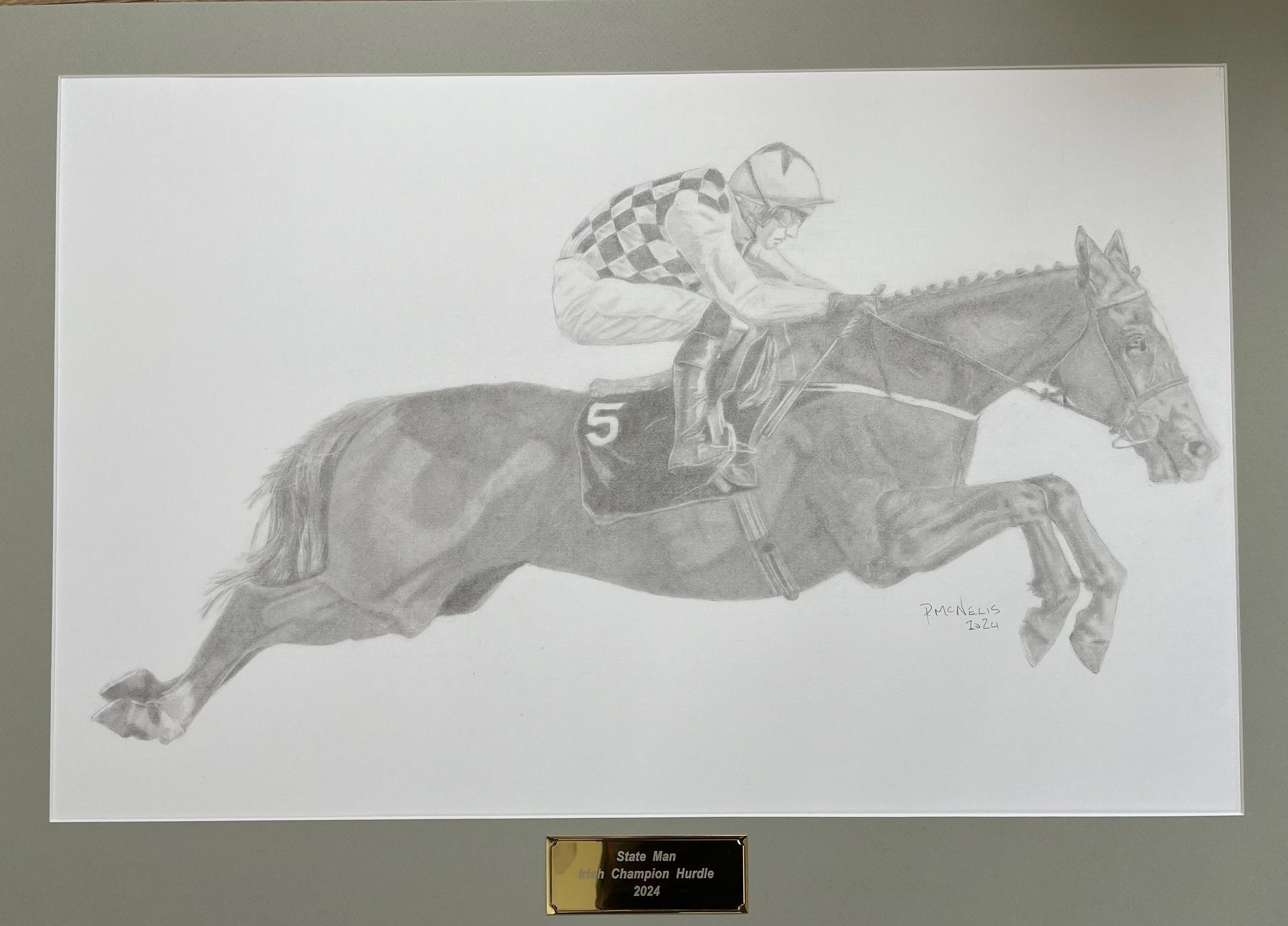 A drawing of a jockey riding a horse with the number 5 on it