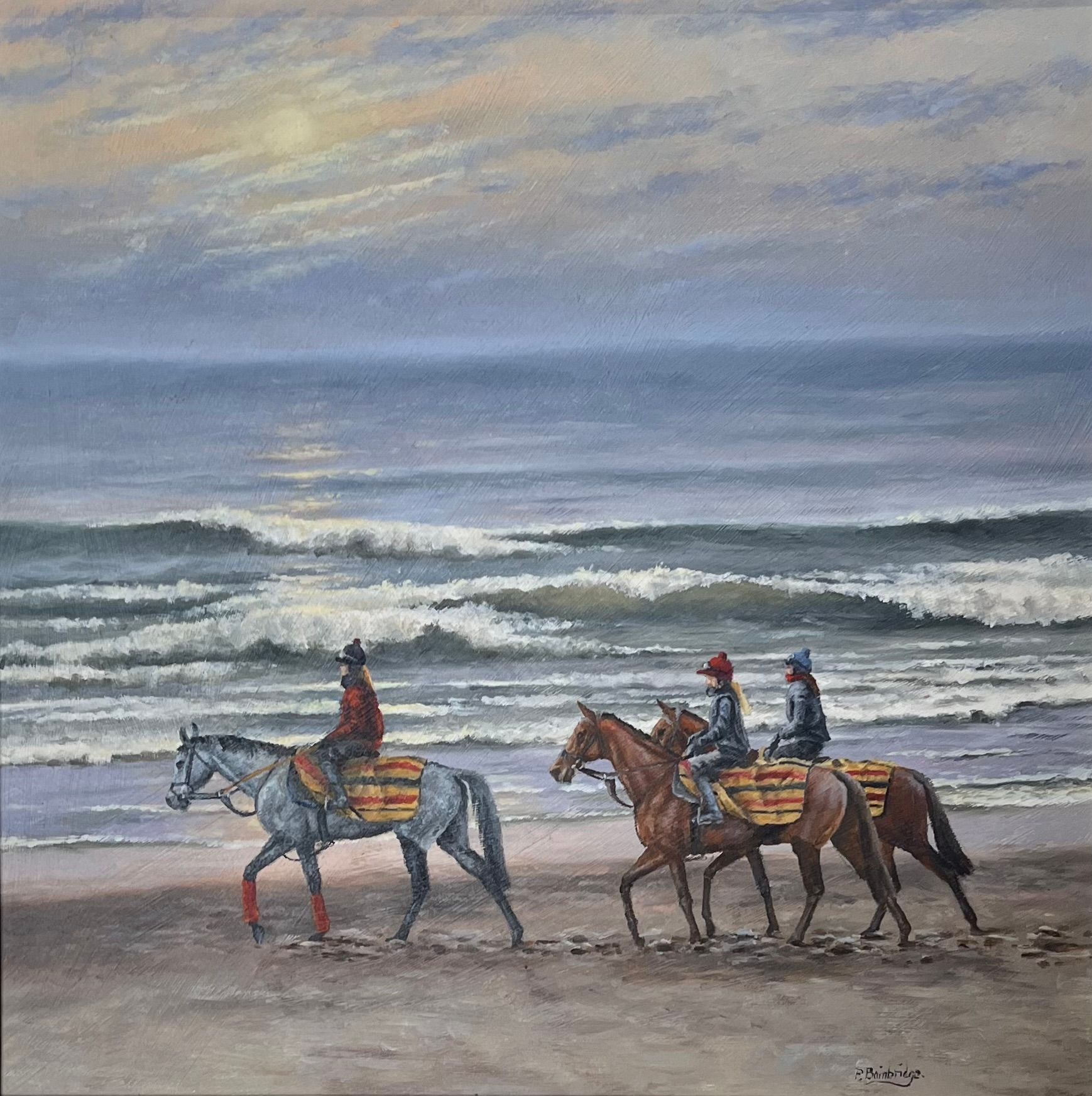 Three horses with riders on a beach, waves crashing. Cloudy sky with sun breaking through.
