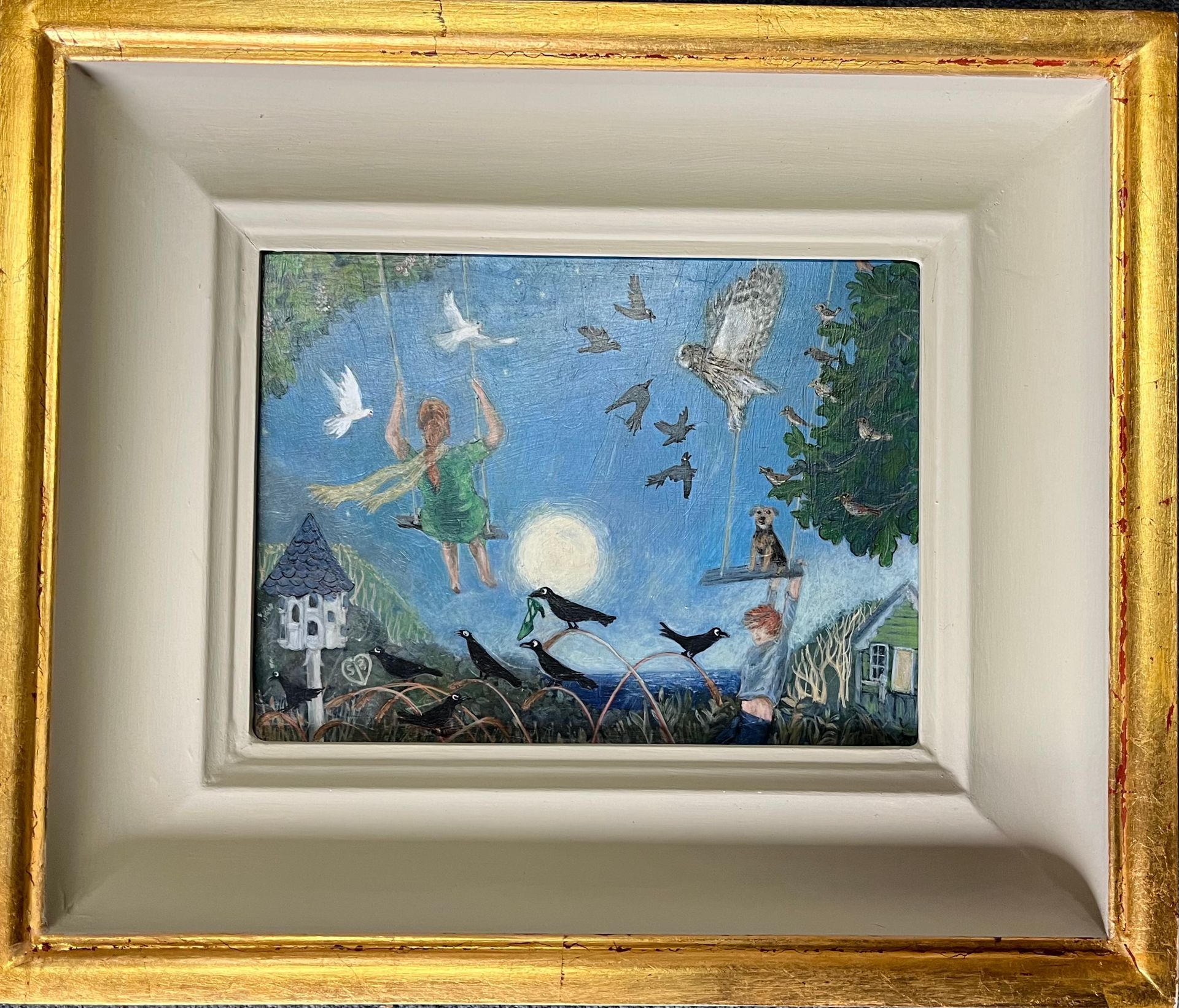 Whimsical painting of a girl surrounded by birds at night. Gold frame, white matting, blue sky.