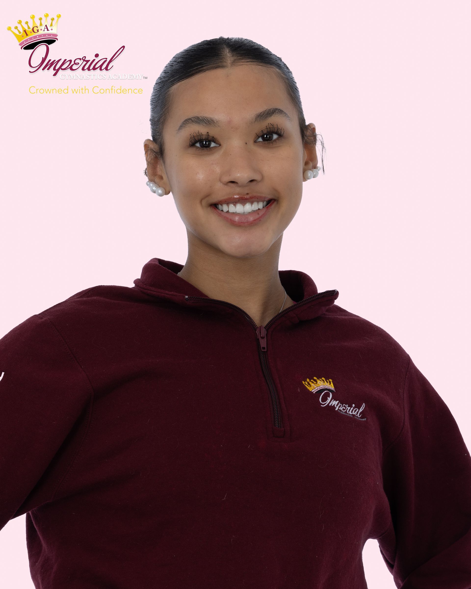 Woman in pink hoodie smiles, logo 
