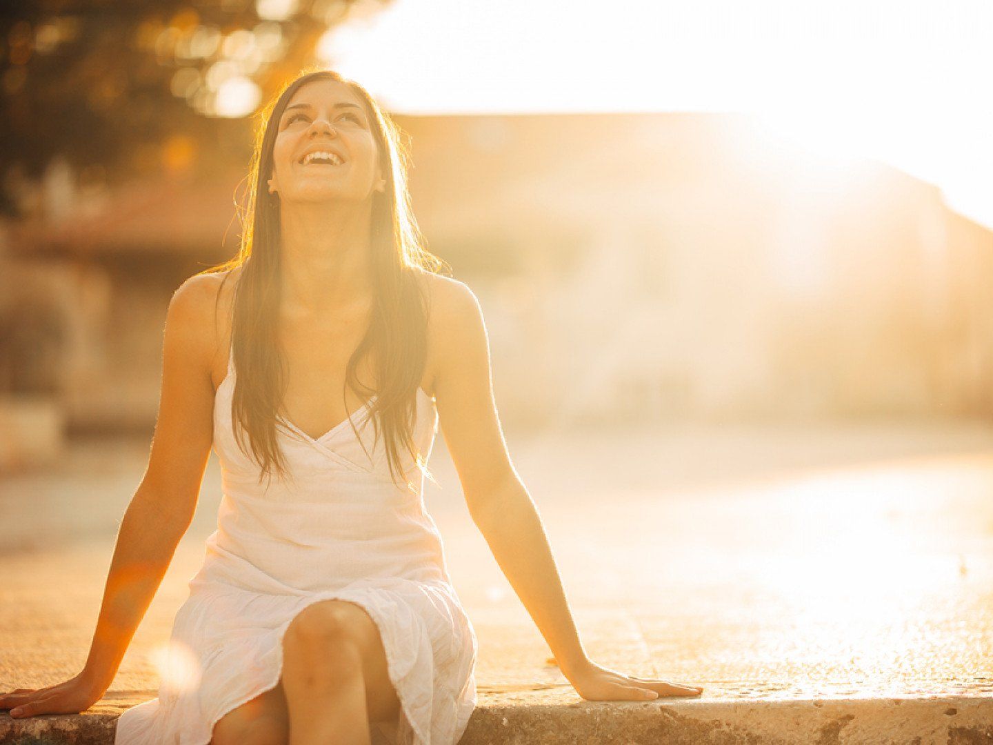 Happy Woman Sitting on Steps