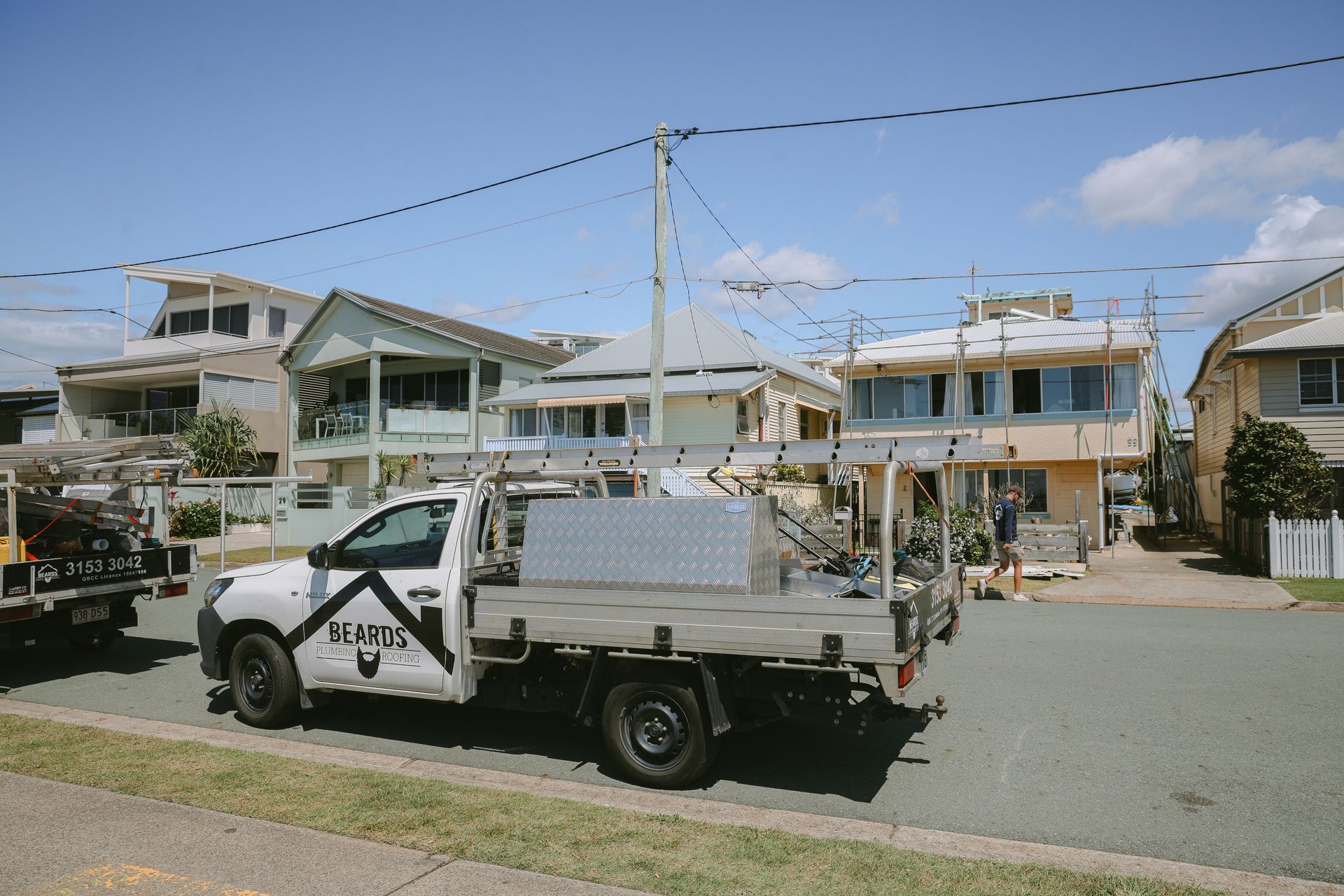 A House Having The Roof Replaced With A Work Ute Out The Front — Beards Roofing and Plumbing in Brisbane, QLD