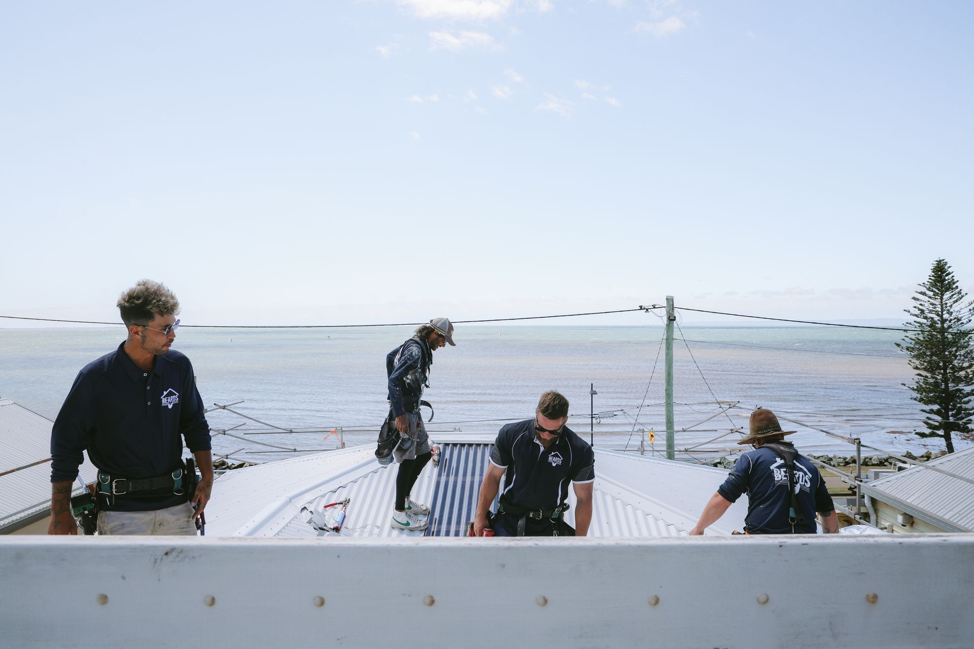 Four Men Completing A Roofing Job — Beards Roofing and Plumbing in Caboolture, QLD