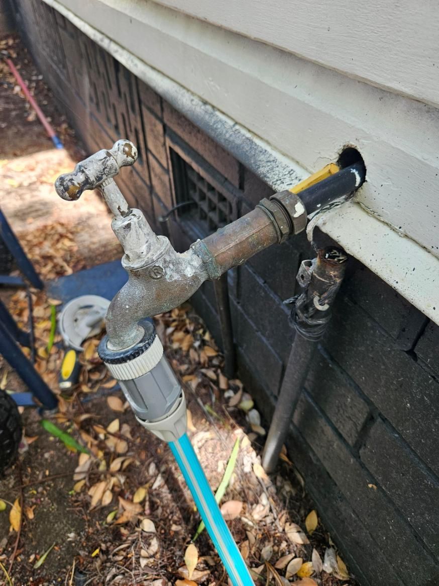 Faucet With a Blue Hose Attached to It is on the Side — Beards Roofing and Plumbing in Clontarf, QLD