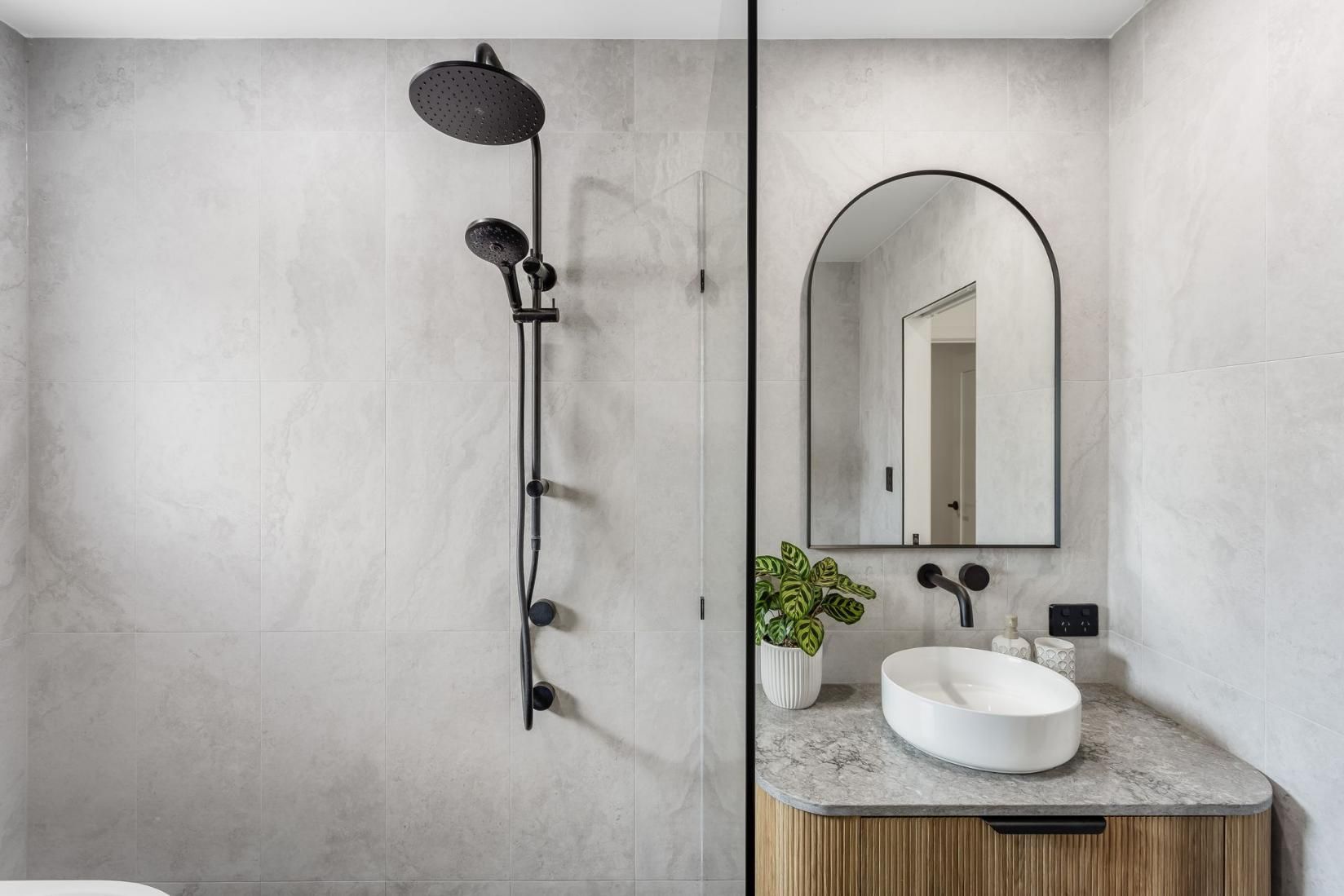 Bathroom With a Sink, Shower, and Mirror — Beards Roofing and Plumbing in Clontarf, QLD