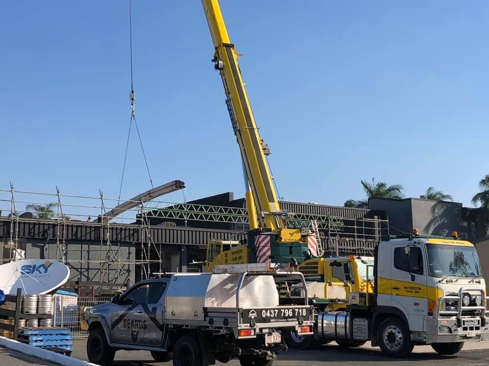 A Truck With a Crane Attached to It and a Sign That Says Sky — Beards Roofing and Plumbing in Brisbane, QLD