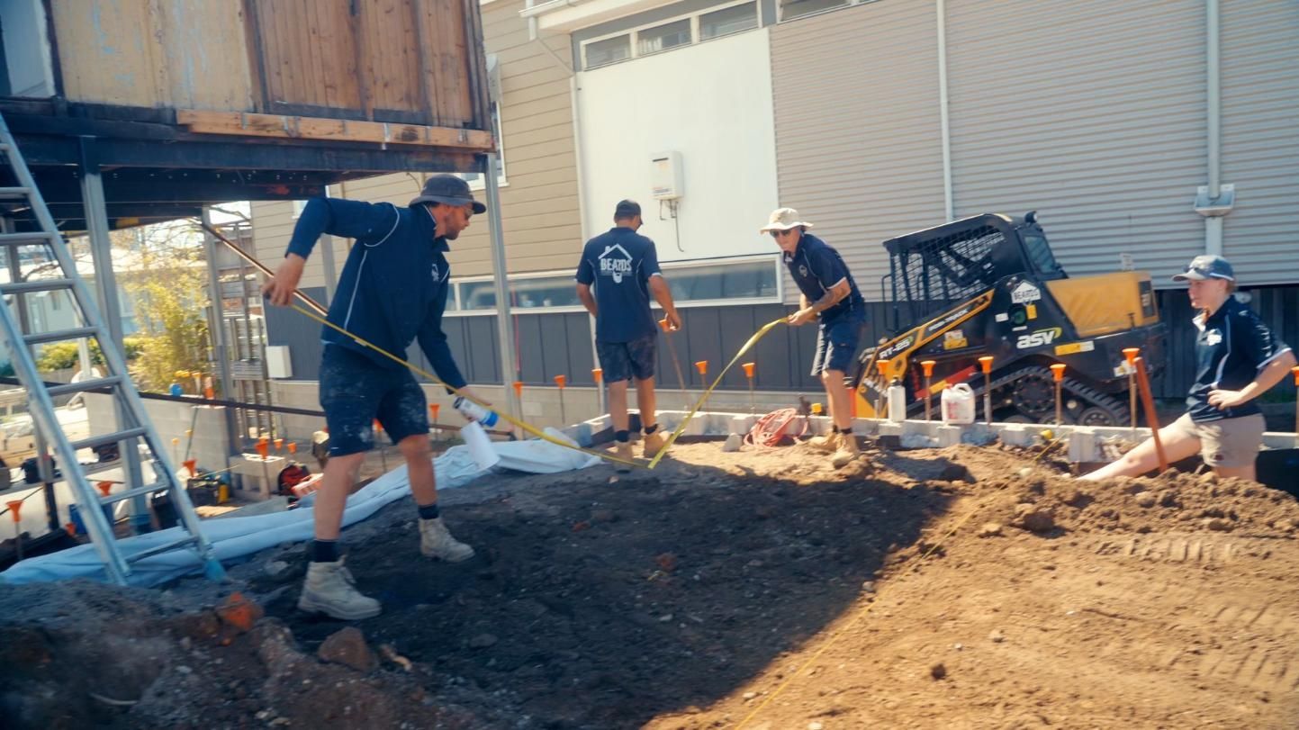 Group of Men Are Working on a Construction Site — Beards Roofing and Plumbing in Clontarf, QLD