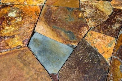 Multicolored natural stone pavers for Whidbey Island landscaping by Creative Gardens.