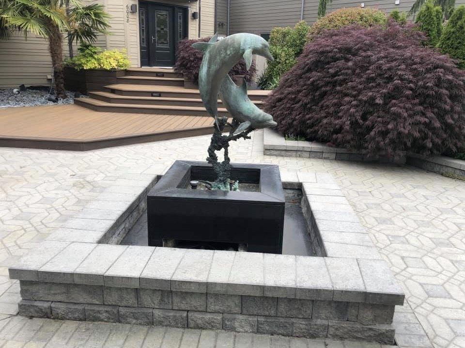 Custom hardscaping and decorative water feature by Creative Gardens on Whidbey Island, WA.