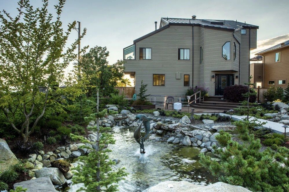 Landscaped backyard pond and water feature designed by Creative Gardens on Whidbey Island, WA.