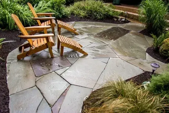 Flagstone patio with Adirondack chairs, Whidbey Island hardscaping