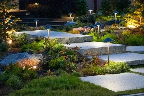 Illuminated stepping-stone path, landscape lighting by Creative Gardens