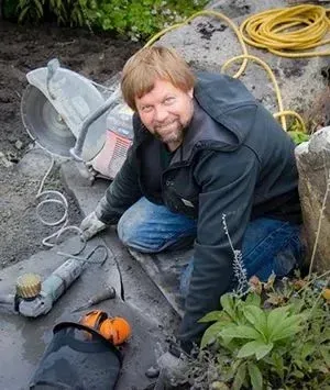 Creative Gardens crew installing underground lighting and utility lines on a Whidbey Island landscape