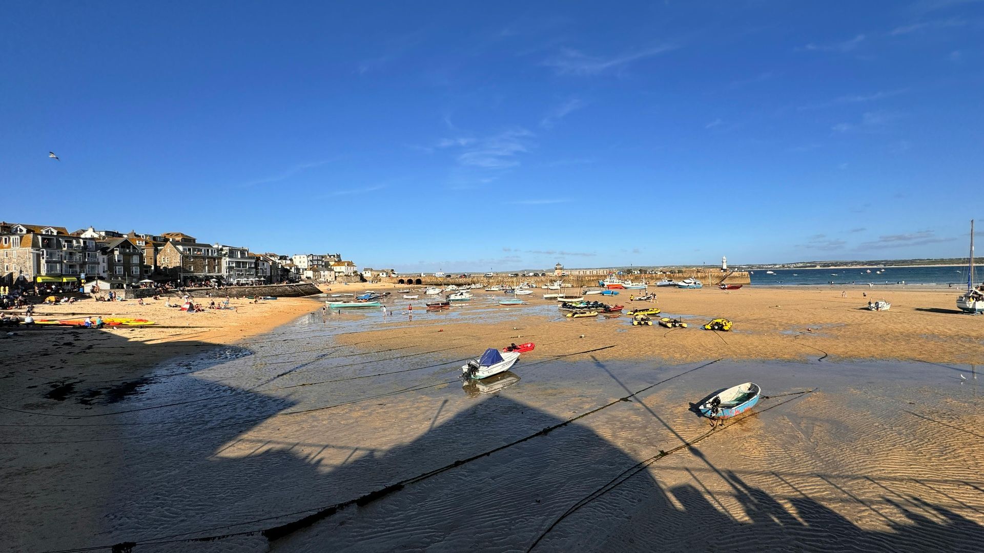 Fishing boats on a Cornwall beach on a sunny day