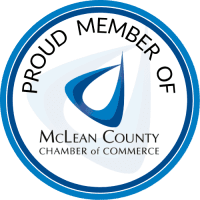McLean County Chamber of Commerce proud member logo with blue circular emblem