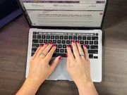 a woman's hands typing