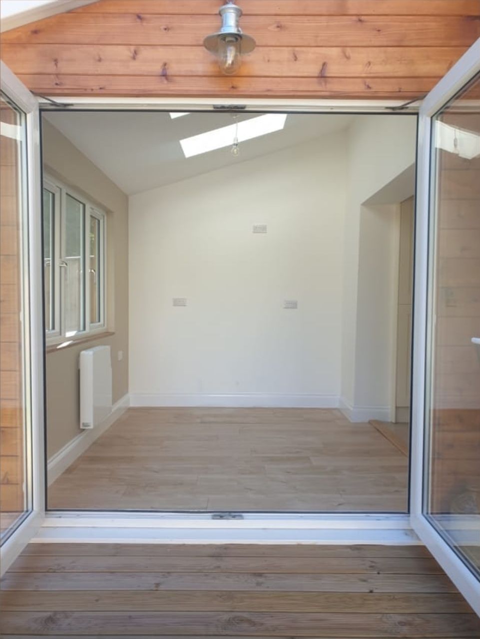 An empty room with a sliding glass door