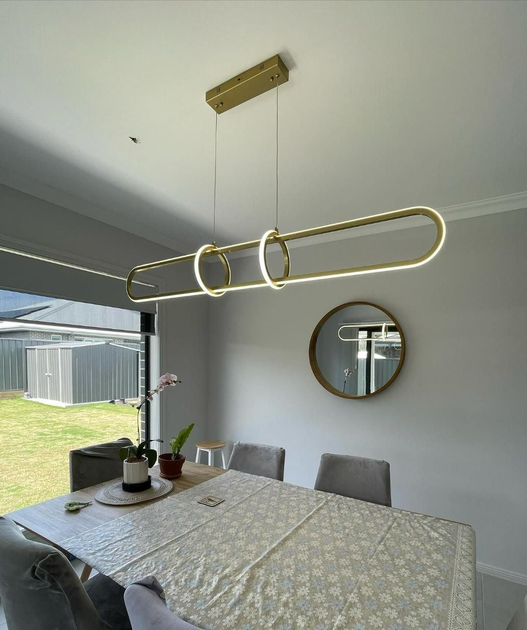 A Dining Room with A Table and Chairs and A Mirror — KARM Electrical Services In Maitland, NSW