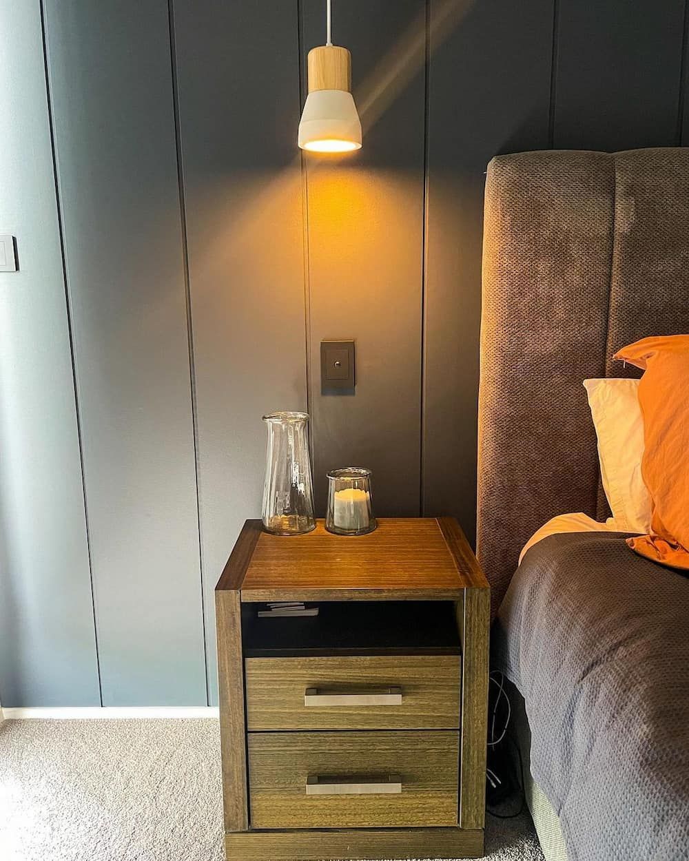 A Nightstand With A Light Next To A Bed In A Bedroom — KARM Electrical Services In Anna Bay, NSW