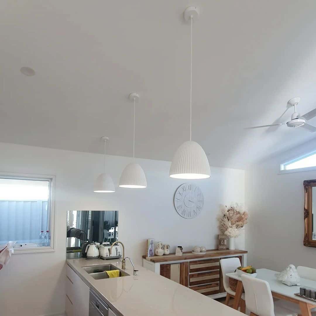 A Kitchen With A New Light Installed — KARM Electrical Services In Anna Bay, NSW