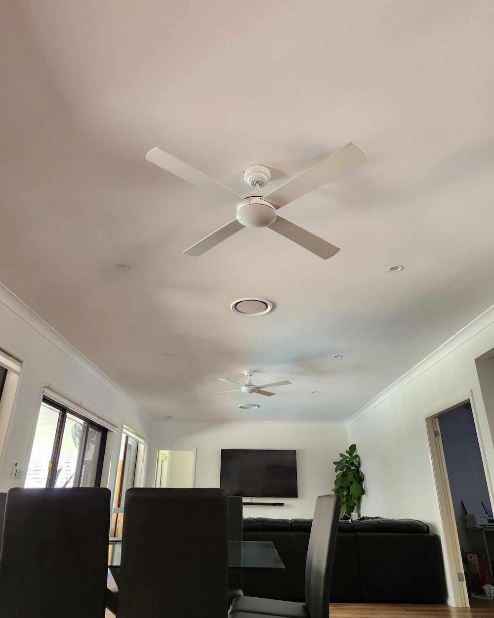 A Living Room With A New Ceiling Fan And A Flat Screen Tv — KARM Electrical Services In Nelson Bay, NSW