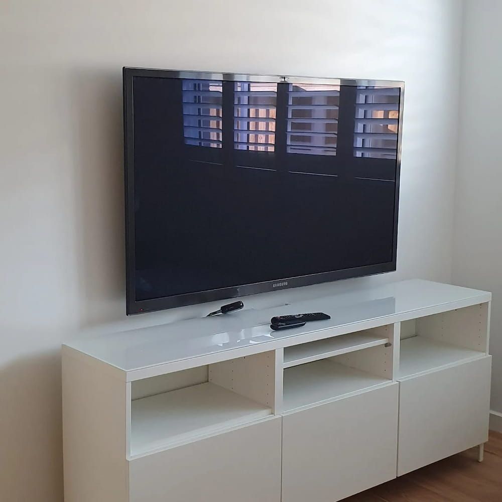 Newly Installed Television On A White Table — KARM Electrical Services In Raymond Terrace, NSW