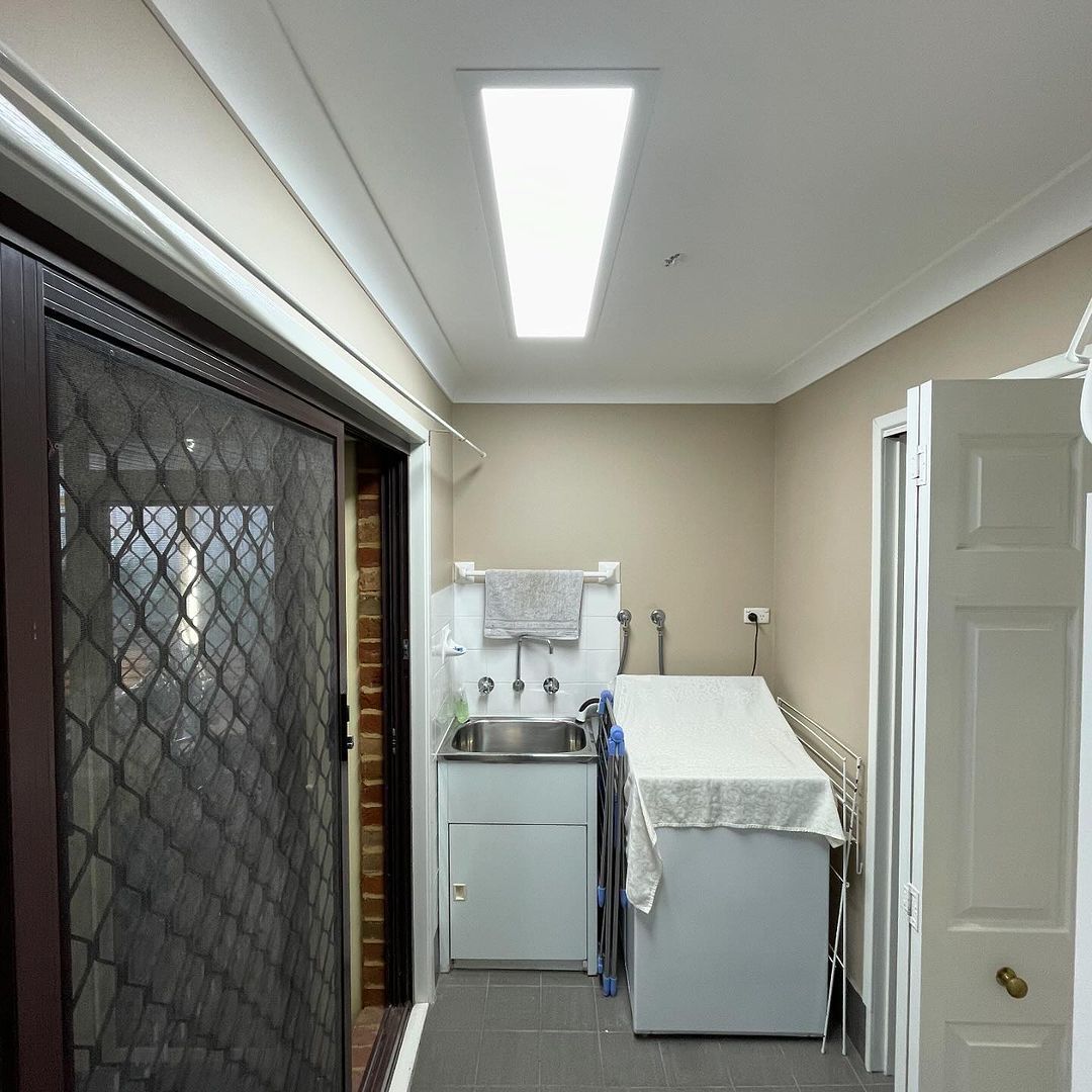 A Laundry Room Under A Newly Installed Light — KARM Electrical Services In Salamander Bay, NSW