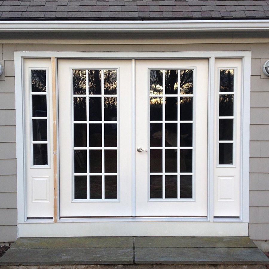 A gray house with white doors and windows