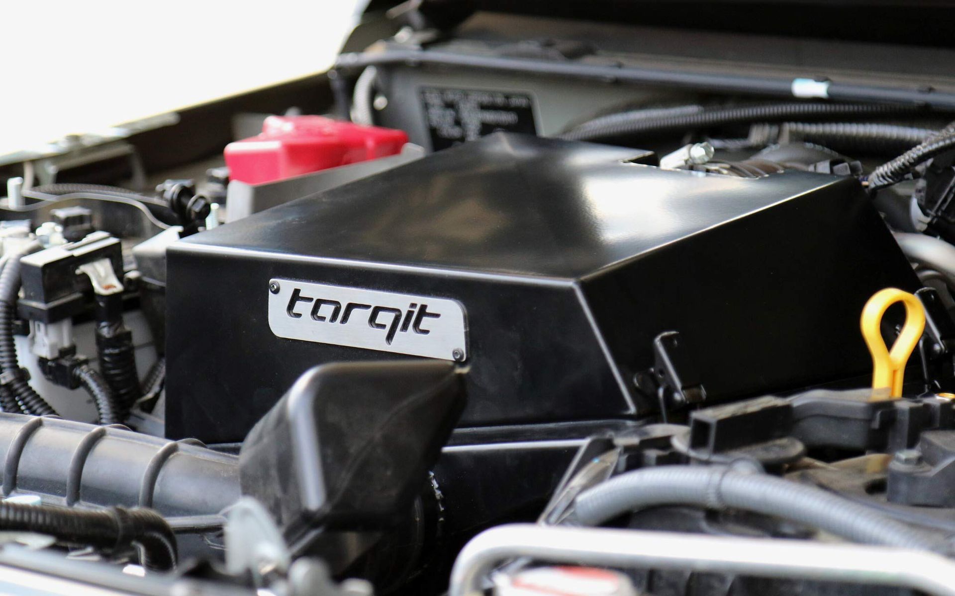 A Close Up Of A Car Engine With Tarqit Written On It — BOEX Tyres And Performance in Bowral, NSW