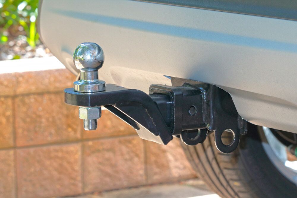 Tow Hitch on a Car With a Chrome Trailer Ball Attached — BOEX Tyres And Performance in Bowral, NSW