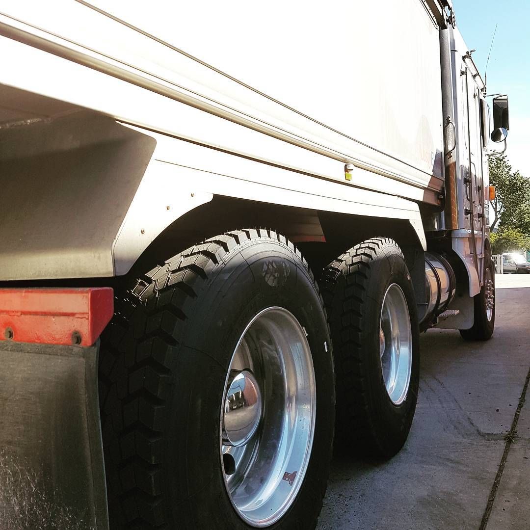 Close-Up of a White Semi-truck’s Rear Wheels Parked — BOEX Tyres And Performance in Bowral, NSW
