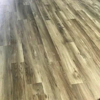 Wood-patterned vinyl flooring in gray and tan tones