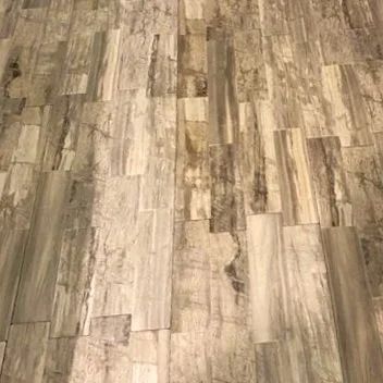 Wood-patterned tile floor in light and dark brown tones
